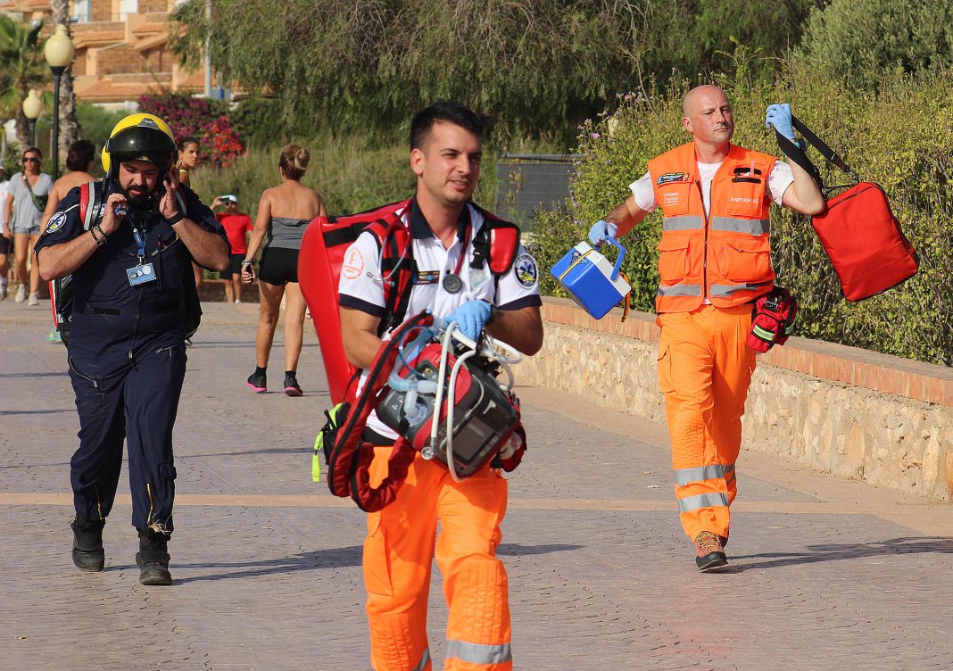 Air ambulance paramedics running to the scene of the accident