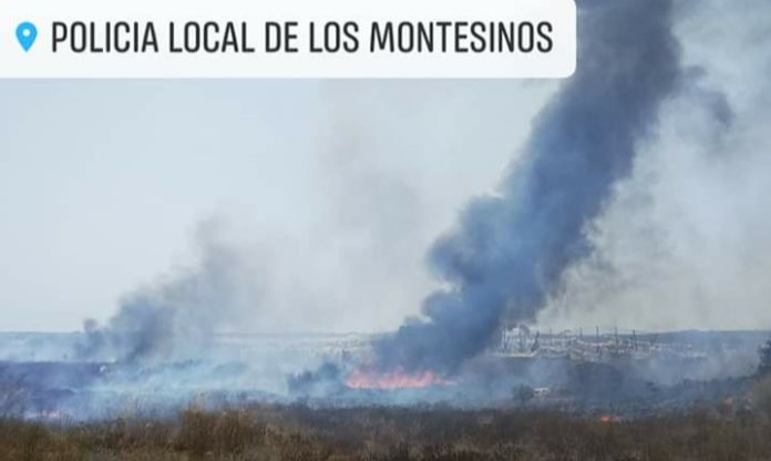 Helicopter, Bomberos and police attend fire in Montesinos