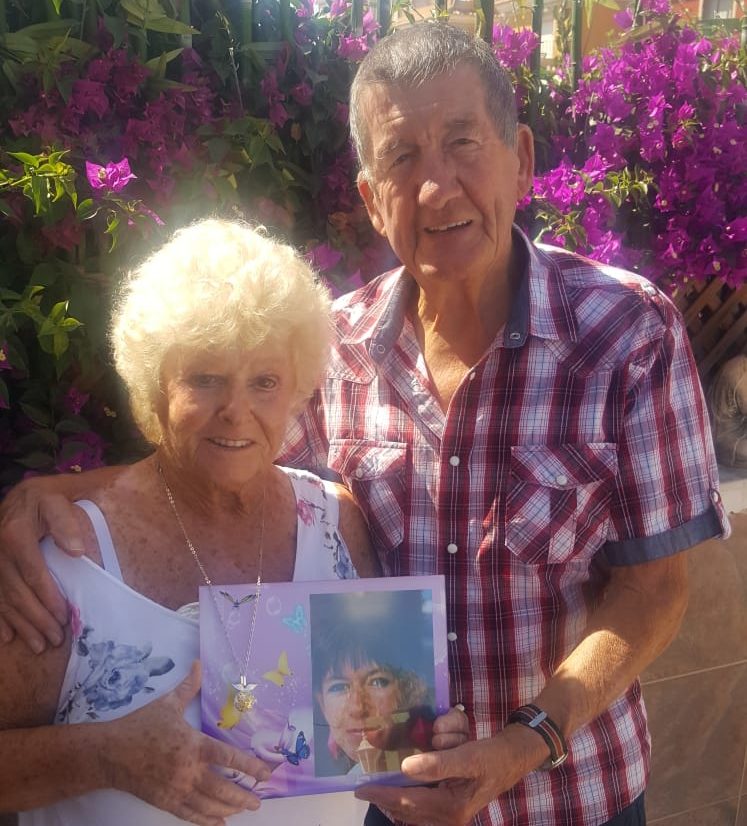 Brenda and George Stanhope with a photograph of daughter Bev.