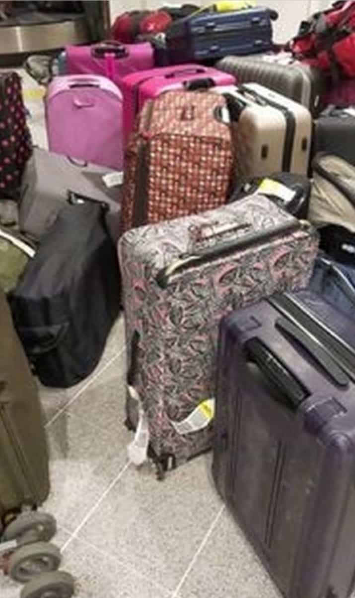 Abandoned luggage in the reclaim hall, along with pushchairs, car seats, golf clubs and suit cases.