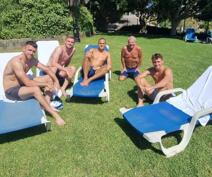 PNE players Ben Whiteman, Liam Lindsay, Brad Potts, supporter Ian Billing and Ryan Ledson chill by the pool at Campoamor Golf. Photo: Ian Billing (c).